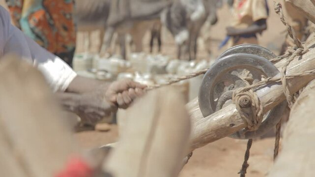 Sudan, Nubia, Naga, people taking water from a well in the desert