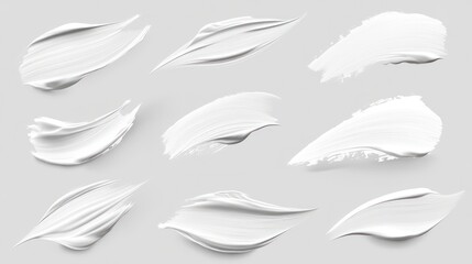 Fototapeta premium White paint brush strokes isolated on a grey background.