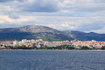 Fototapeta premium Contemporary buildings, gardens and beaches at the waterfront in Split, Croatia. View of Split from the boat.