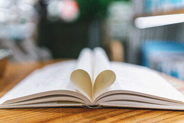 Captivating Open Book with Heart-Shaped Pages on Wooden Table