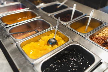 Colorful Dessert Toppings Bar with Variety of Options for Custom Creations