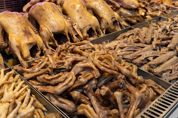 Vibrant Display of Fresh Poultry and Exotic Meats in Local Market