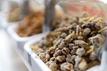 Assorted Nuts in Display Bins for Delicious Snacking Options