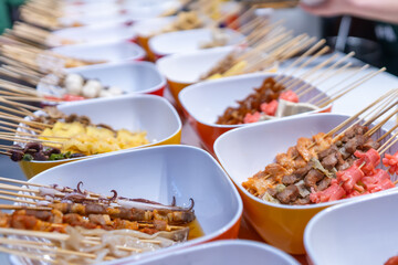 Colorful Array of Skewered Delicacies at a Vibrant Market