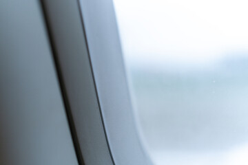 A Close-Up of an Airplane Window Frame Capturing Travel Anticipation