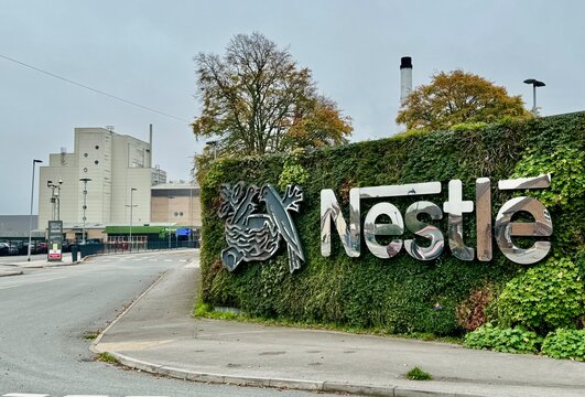 The Nestle sign and logo outside the Nestle Factory in Hatton, Derbyshire, UK. October 2024. 