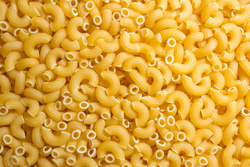 Uncooked Chifferi Rigati Pasta: A Culinary Canvas of Chifferi Rigati, Creating a Lively and Textured Background for Gourmet Cooking. Dry Pasta. Raw Macaroni - Top View, Flat Lay