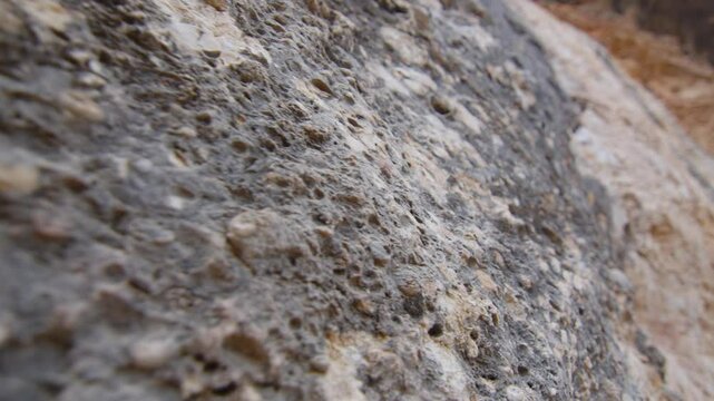 Macro shot of a rock in relief on a climbing wall in the Margalef region, Spain