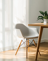 minimalist Scandinavian style chair beside wooden table, illuminated by natural light. serene atmosphere is enhanced by green plant and soft curtains
