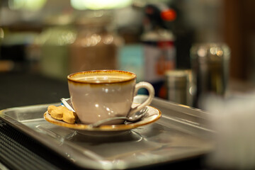 a glass of cappuccino placed on the table
