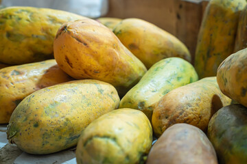 Papayas is sold together with other fruit by fruit traders in traditional markets