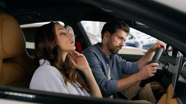 Sad upset frustrated Caucasian couple family woman girl female man guy male failure lose suffer bad news buying car problem traffic jam sitting inside auto in salon showroom automobile trouble breakup