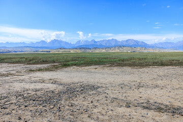 Dirt gravel road square and mountain natural landscape under blue sky. car background.