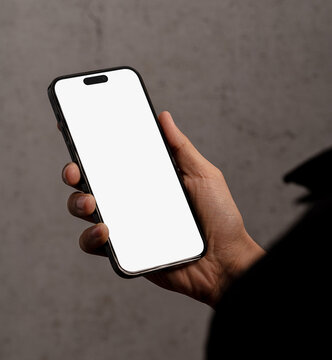 modern smart phone mockup, hand holding mobile phone mockup with blank screen in dark area