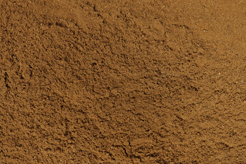 Sand forming a wavy pattern with cracks in wenceslas square Prague