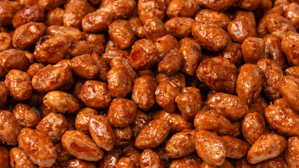 Tasty sweet roasted peanuts as a background.