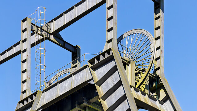Barony A-Frame pithead winding head gear tower metal wheels with spokes, historic industrial heritage site East Ayrshire Scotland