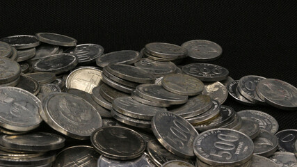 Stack of Indonesian coins isolated