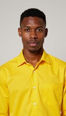 Obraz premium A lively image featuring a youthful African American man in a bright yellow top