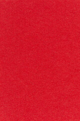 Fototapeta premium Macro image of a red paper napkin. Red textured vertical background image.