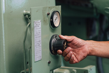 Industrial worker indoors in old factory. Industrial man Engineers in Hard Hats.Work at the Heavy Industry Manufacturing Factory.