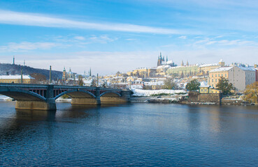 Cold winter morning in Prague, snow in the city and Prague castle