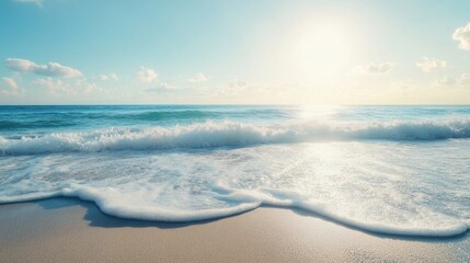 Fototapeta premium A peaceful beach scene with gentle waves and soft sand under a clear blue sky