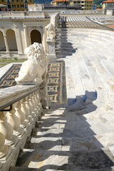 Obraz premium Ligurian city. Staircase with lion sculptures.White marble statues in front of the church of Santo Stefano. Lavagna, Liguria, Italy