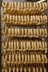close up of rack with sausages ready to be loaded into a smoking chamber in the production of sausage products