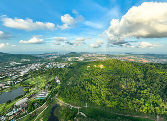 Obraz premium Aerial view of residential houses and driveways neighborhood during in sunny time.High angle view over building houses in phuket thailand