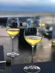 Elegant Evening: White Wine Glasses on Terrace with View - Perfect for Relaxation and Luxury