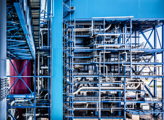 Architecture details of steel structure building and steel pipelines in a factory zone 