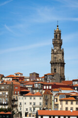 Fototapeta premium Clerigos Church and Old Traditional Houses on Porto City, Portugal on Sunny Day
