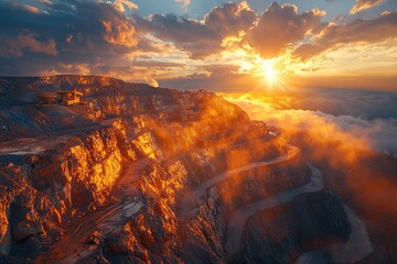 Quarry at Sunset with Machinery and Dramatic Clouds