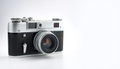 A vintage camera on side position provides copy space for text. background concept isolated white