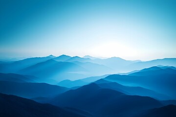 Naklejka premium Misty mountain range under soft blue twilight skies in summer