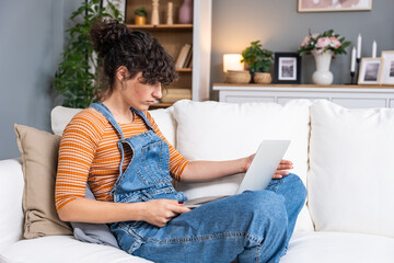 Young woman or girl looking at laptop computer screen with eyes wide open, cant believe that her...