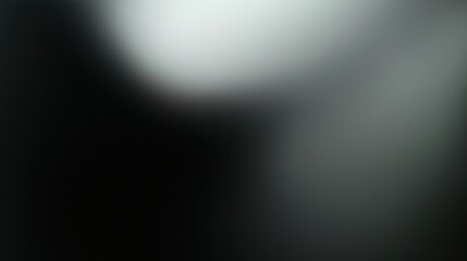 Obraz premium Minimalist black background with a soft gradient from dark gray to light black, designed with high resolution and subtle texture for enhanced visual impact. This background features a delicate, blurry