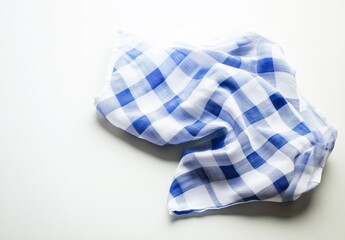Crumpled blue and white checkered cloth on a white background