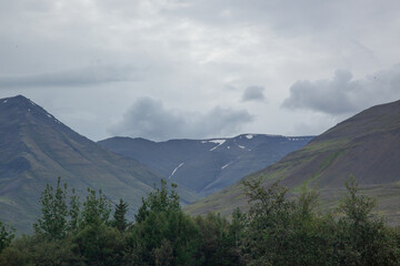 Fototapeta premium Icelandic mountains with low clouds