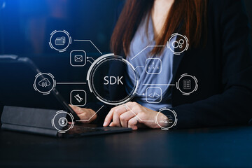 SDK  Software development kit programming language technology concept, Person typing laptop computer