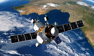 a satellite moving in outer space around the earth