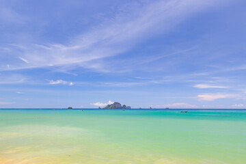 Blue sky and sea with tourist boat at Ao Nang or Nopparat Thara Beach, a destination of tourist in Krabi, Southern of Thailand