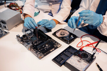 Close up of Technician measuring voltage electronic circuit board, Service after sale fix electric equipment.