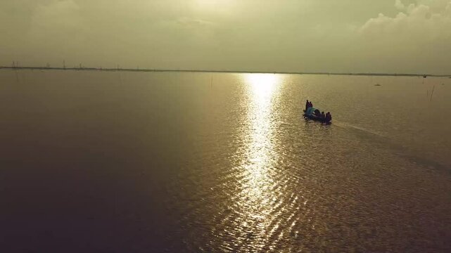 Drone arial view of Jamuna river Bangladesh, boat, ship, bulkhead moving through the river, life of riverbank people, 