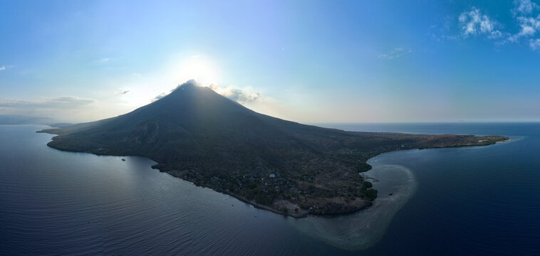 Afternoon light illuminates the volcano of Iliape on the island of Lembata in Indonesia. This active volcano, within the Lesser Sunda Islands, is part of the Ring of Fire and the Coral Triangle.