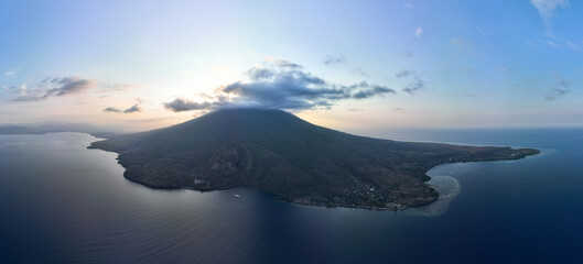 Evening light illuminates the volcano of Iliape on the island of Lembata in Indonesia. This active volcano, within the Lesser Sunda Islands, is part of the Ring of Fire and the Coral Triangle. © ead72