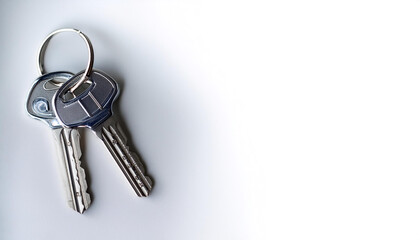 Keys and key chains on side position provides copy space for text. background concept isolated white
