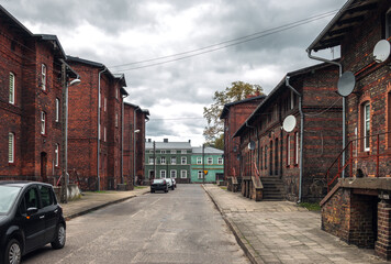 Old residential red brick houses built for railroad workers on Kr&oacute;tka street in Krzyż Wielkopolski, Poland. Autumn view