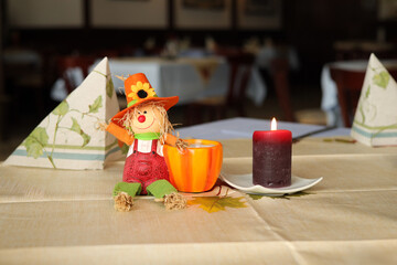 An autumnally decorated table in a rustic restaurant